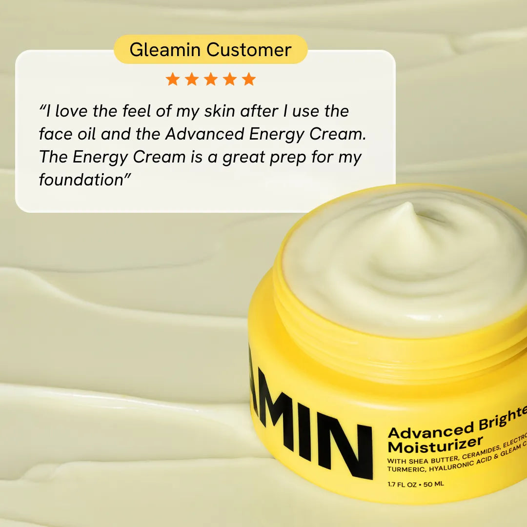 Open yellow moisturizer jar with smooth pale cream swirl on top.