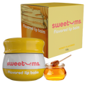 Honey flavored lip balm jar with yellow cap and honey dipper beside lip balm box