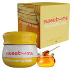 Honey flavored lip balm jar with yellow cap and honey dipper beside lip balm box