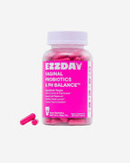 Vaginal probiotic capsule bottle with pink label and pink capsules