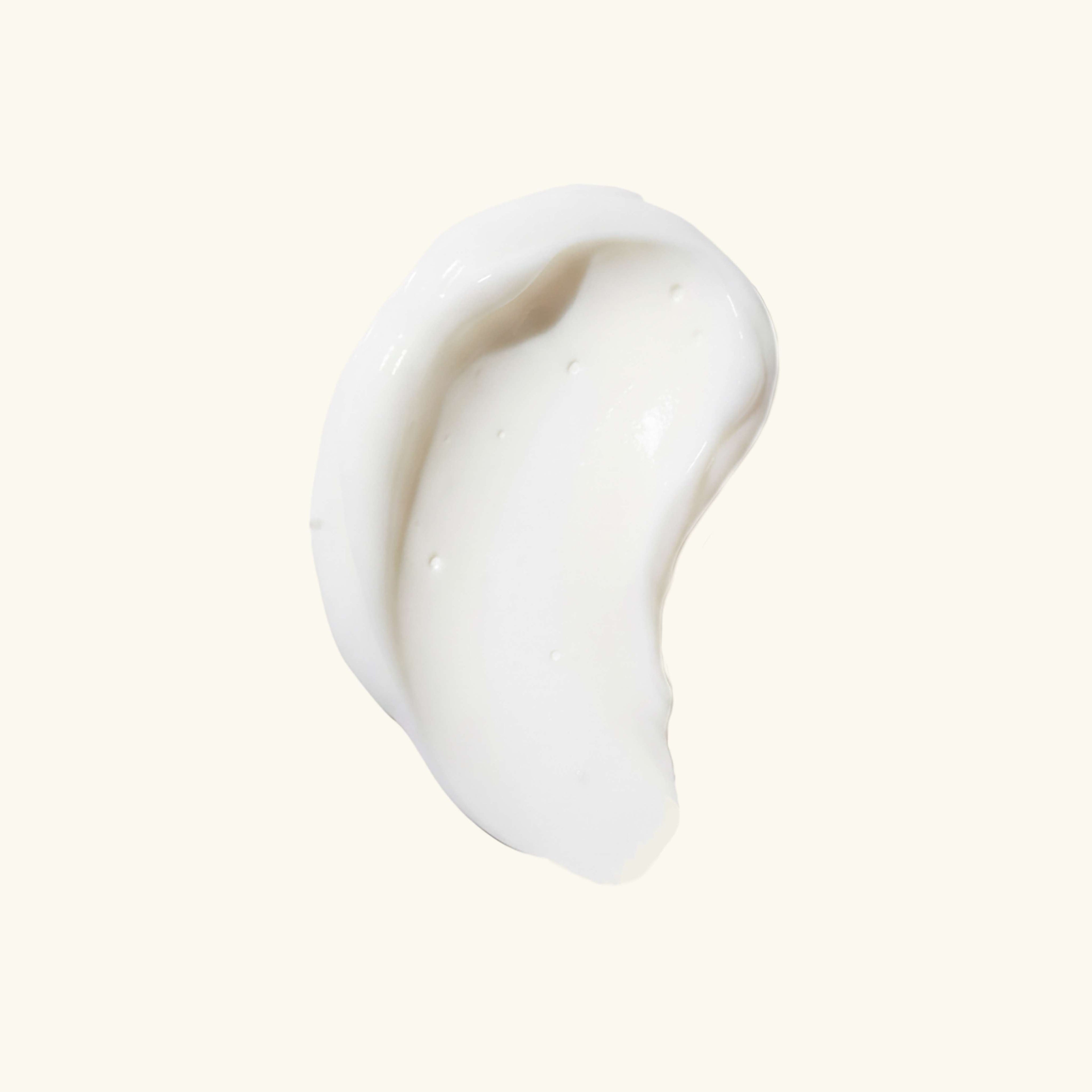 White cream swatch texture of intimate serum on light background