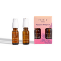 Passion Play Kit set with two amber oil bottles and pink retail box