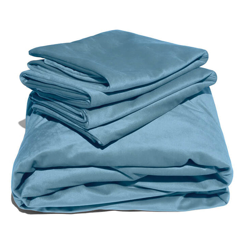 Blue liquid velvet sheet and pillowcases set, neatly folded with glossy sheen folds.