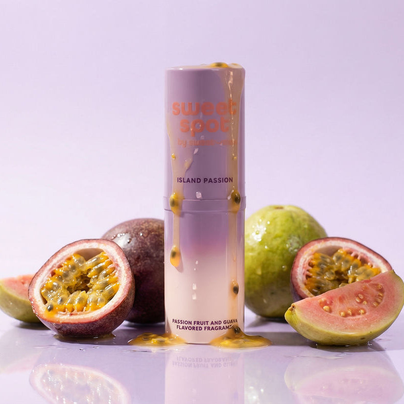 Lavender-purple solid fragrance stick tube with gold drip accents and a twist cap