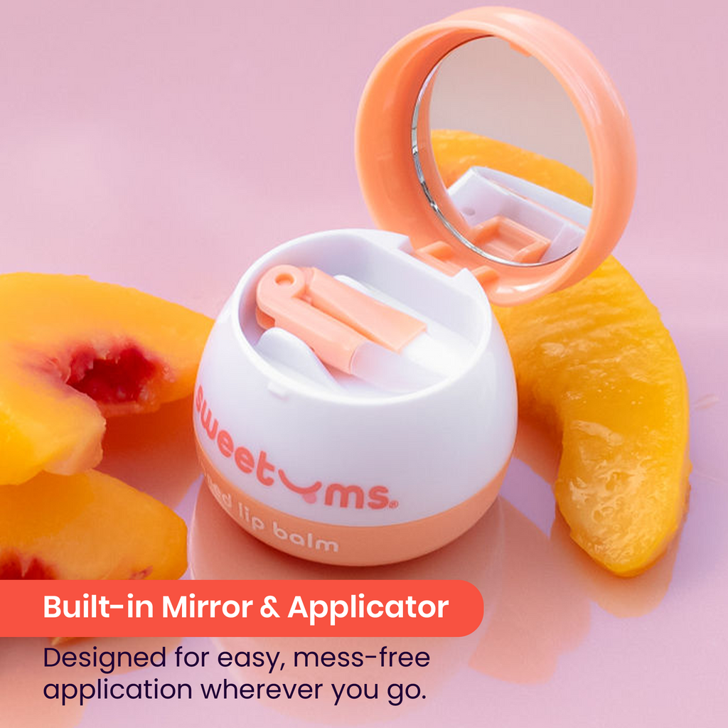 Peach flavored lip balm jar opened with built-in mirror and applicator