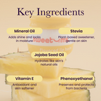 Pineapple-flavored lip balm with yellow balm smear and ingredient callouts
