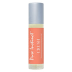 Pheromone roll-on perfume bottle with silver cap and orange label
