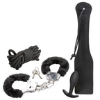 Bondage kit with long black butt plug, rope, fuzzy cuffs, and metal chain restraints
