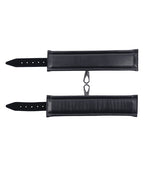 Black cuff straps with rows of holes and metal ring dangles, flat lay.
