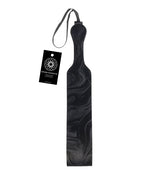 Velvet paddle with dark marbled pattern and loop handle, includes hanging tag