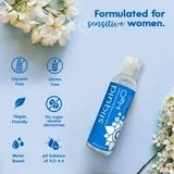 Blue intimate lubricant bottle with informational icons on the front label