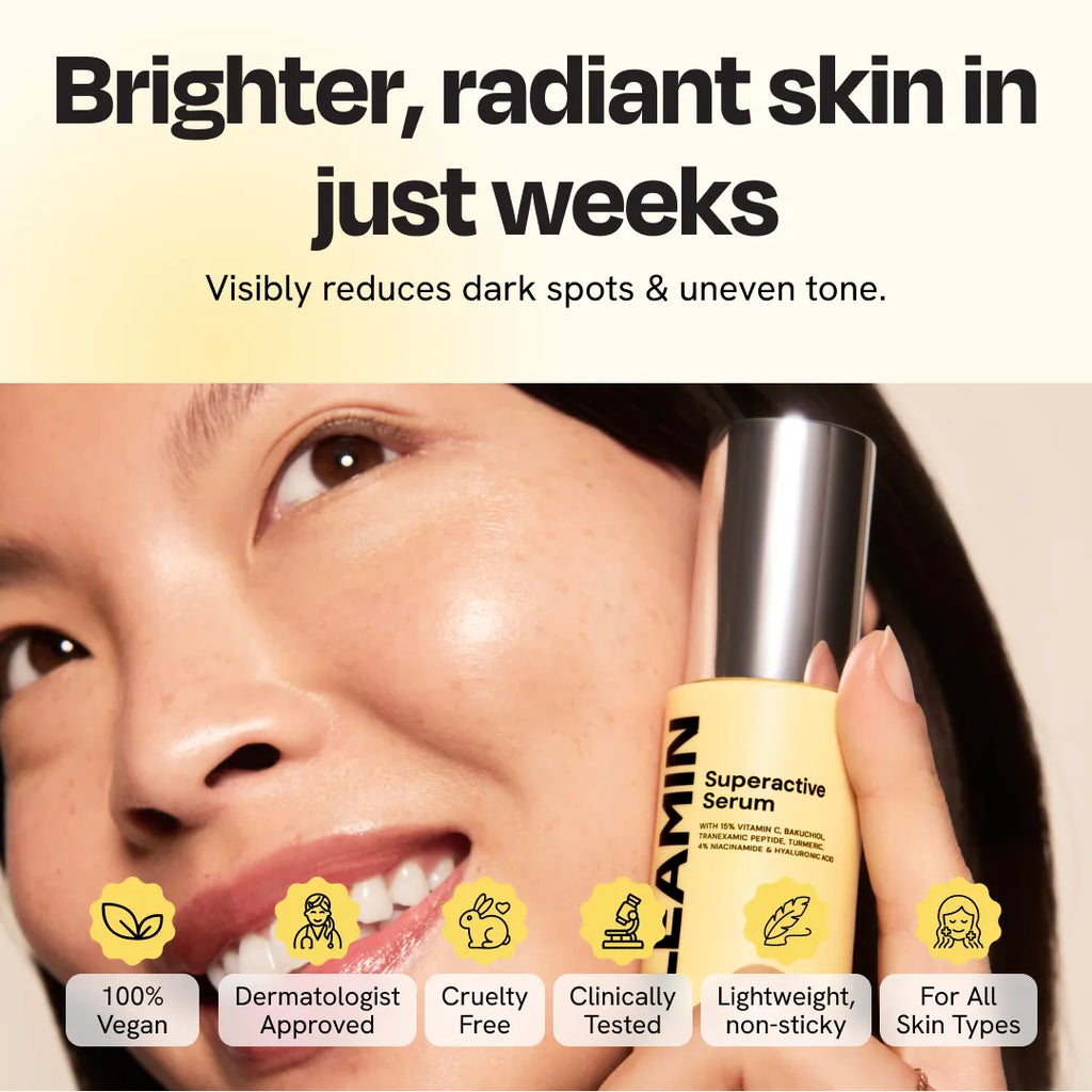 Superactive Serum yellow bottle held near woman's cheek for application