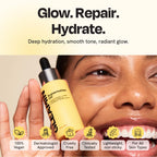 Skincare oil bottle held in hand with black dropper, yellow bottle and label