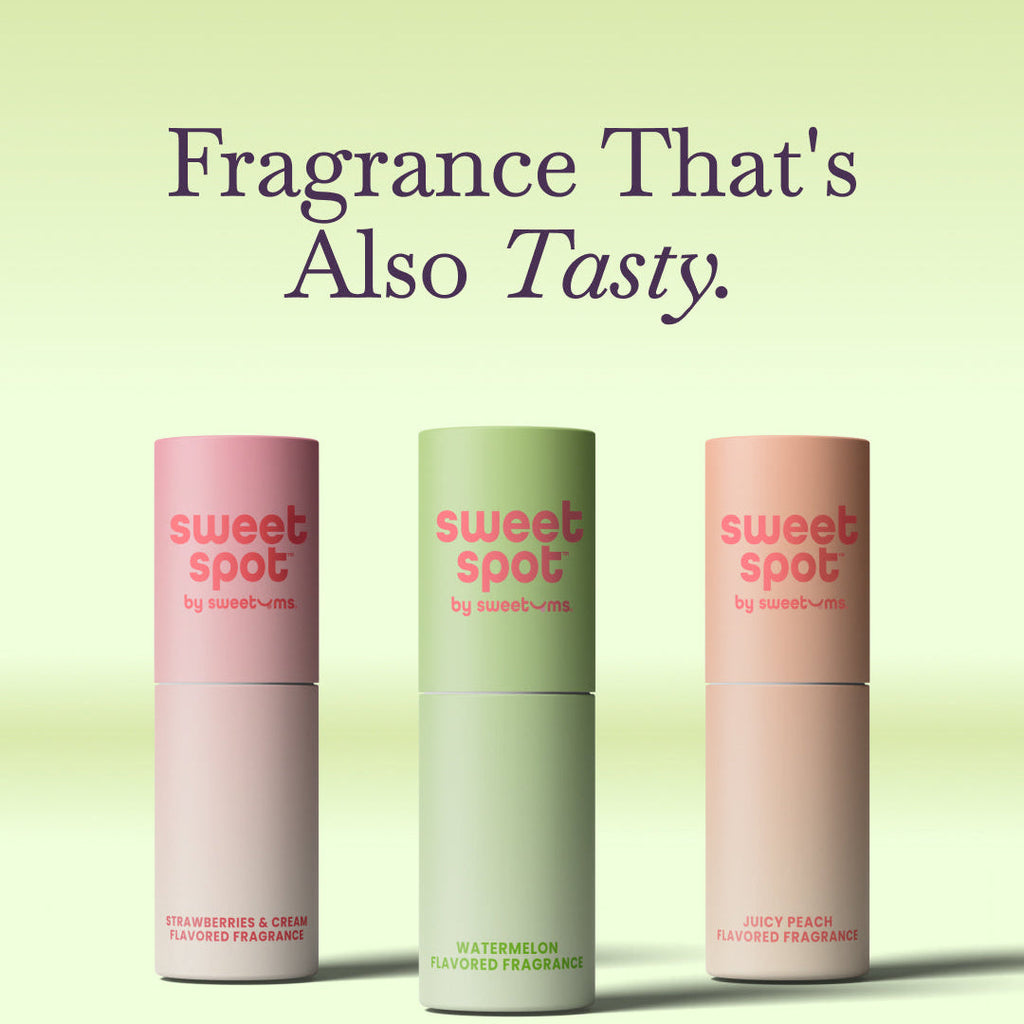 Three slim roll-on fragrance tubes in pink, green, and peach