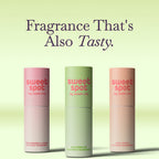 Three slim roll-on fragrance tubes in pink, green, and peach