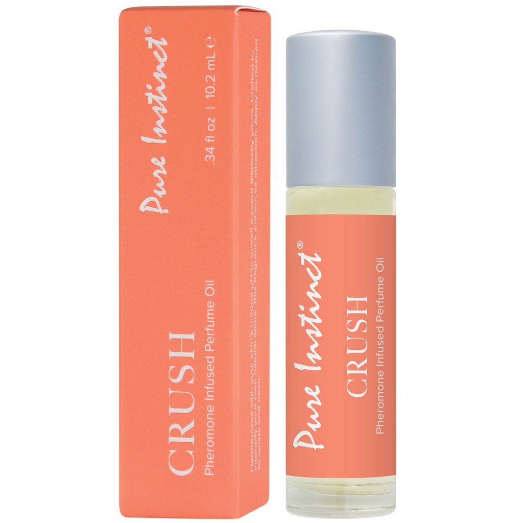 Pheromone roll-on perfume bottle with orange label next to matching box