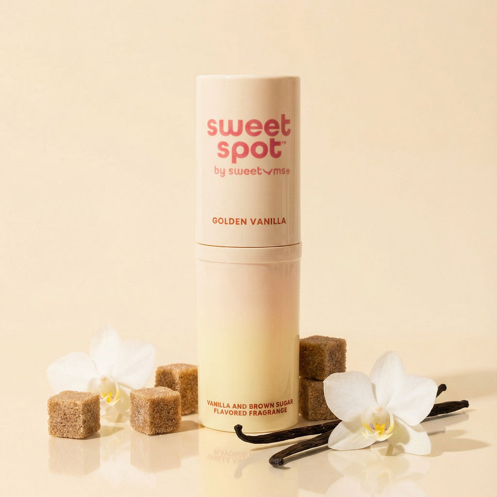 Golden vanilla solid fragrance stick with beige twist-up container