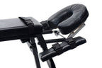 Black padded sex bench close-up of arm and leg restraint straps