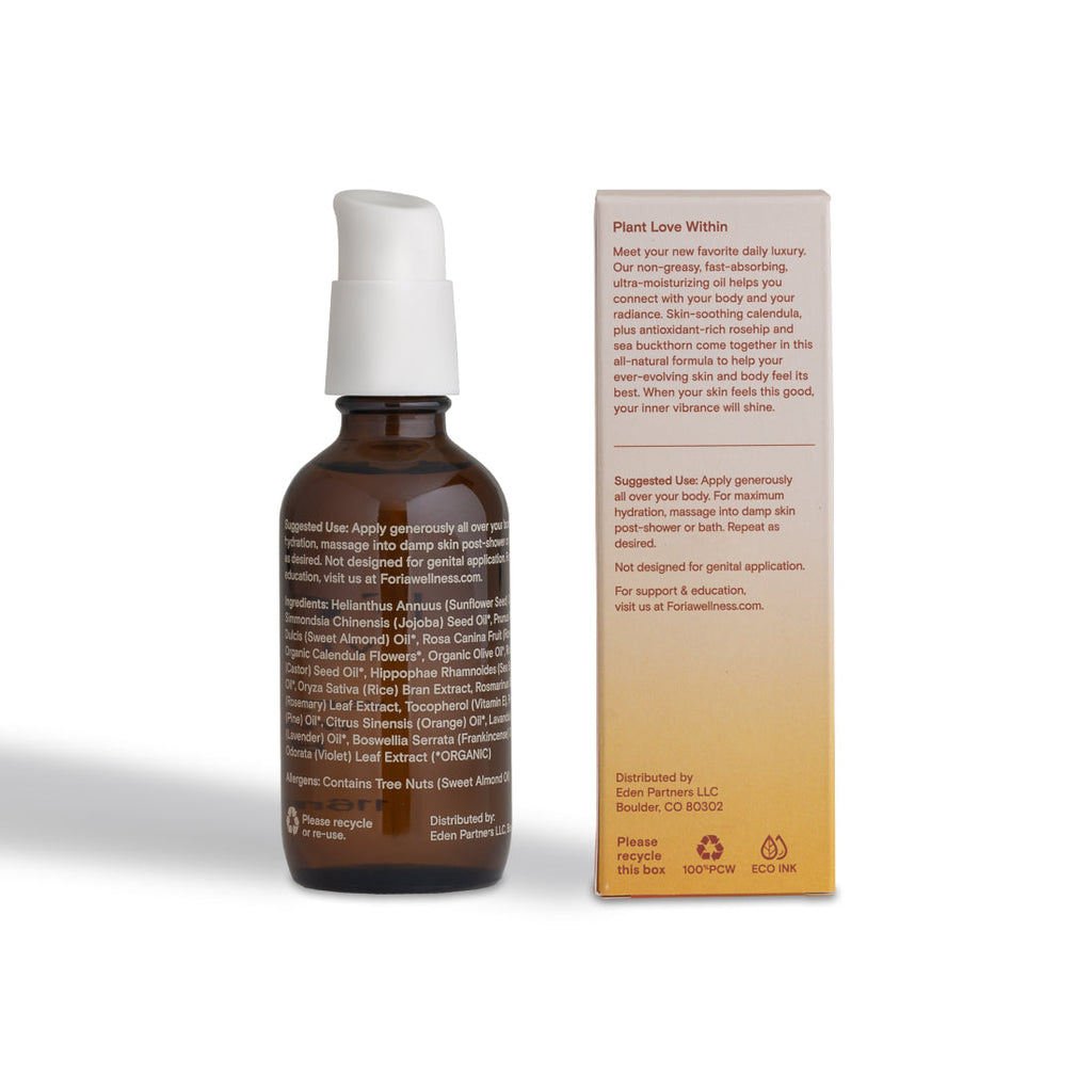 Body oil bottle with white pump and back-box ingredient panel