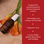 Vulva moisturizer bottle near orange and green flowers, with red box side panel