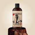 Body wash bottle with black pump and illustrated label