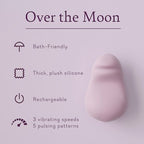 Pink teardrop silicone personal massager with small circular detail on smooth surface