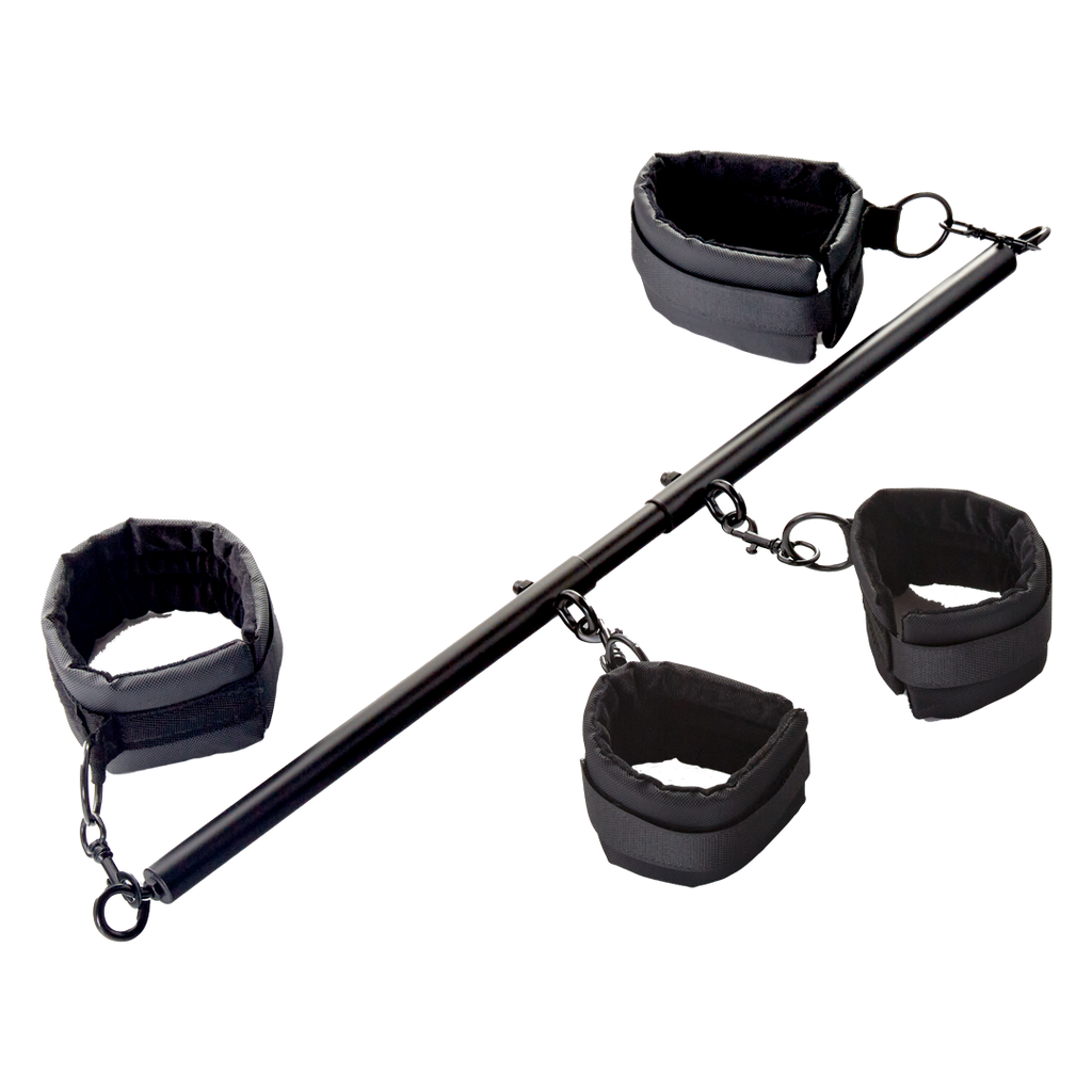 Black fabric cuff restraints set with metal bar and chain links, angled view