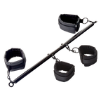 Black fabric cuff restraints set with metal bar and chain links, angled view