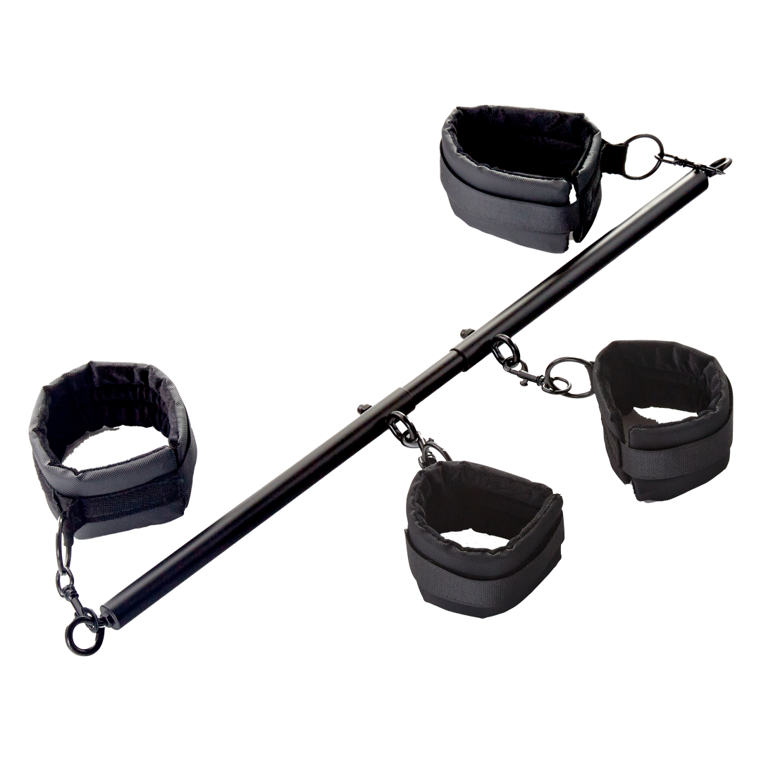 Black fabric cuff restraints set with metal bar and chain links, angled view