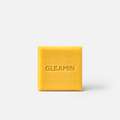 Yellow square body bar soap with centered logo on a white background