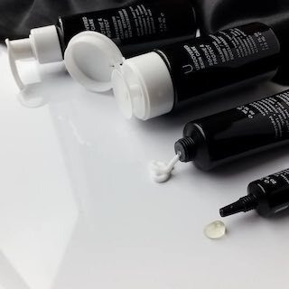 Uncovered Skincare Daily Essentials Kit with tubes and a dropper bottle