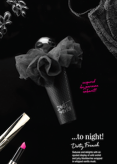 Dark perfume bottle with oversized black tulle bow and clear cap