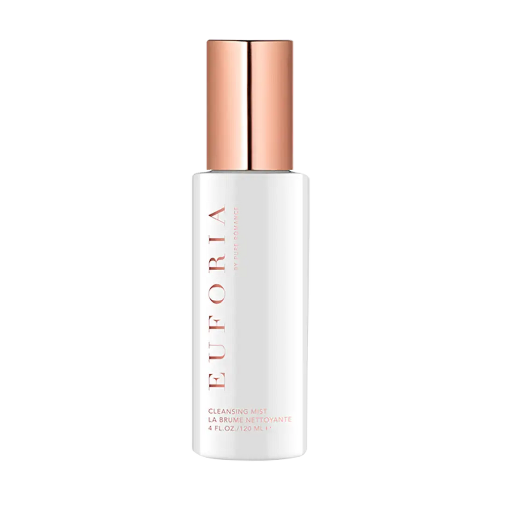 Cleansing mist bottle with rose-gold cap, white label, and spray nozzle