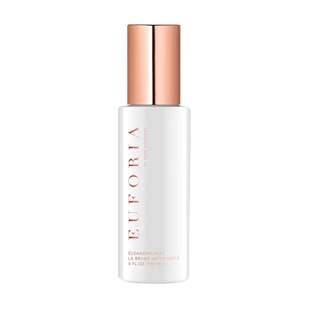 Cleansing mist bottle with rose-gold cap, white label, and spray nozzle