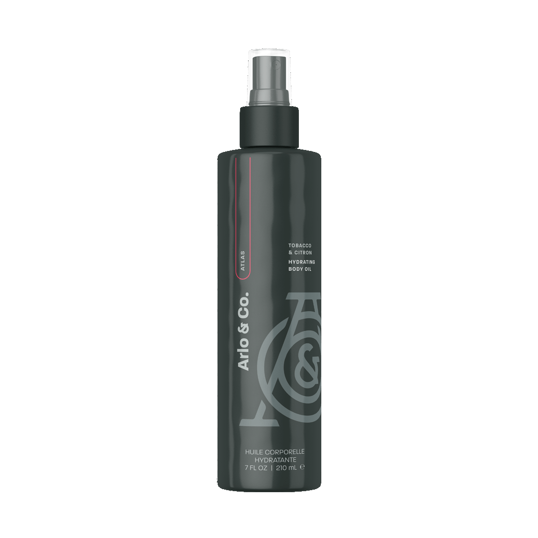 Hydrating body oil bottle with black pump, dark bottle with gray logo and text.