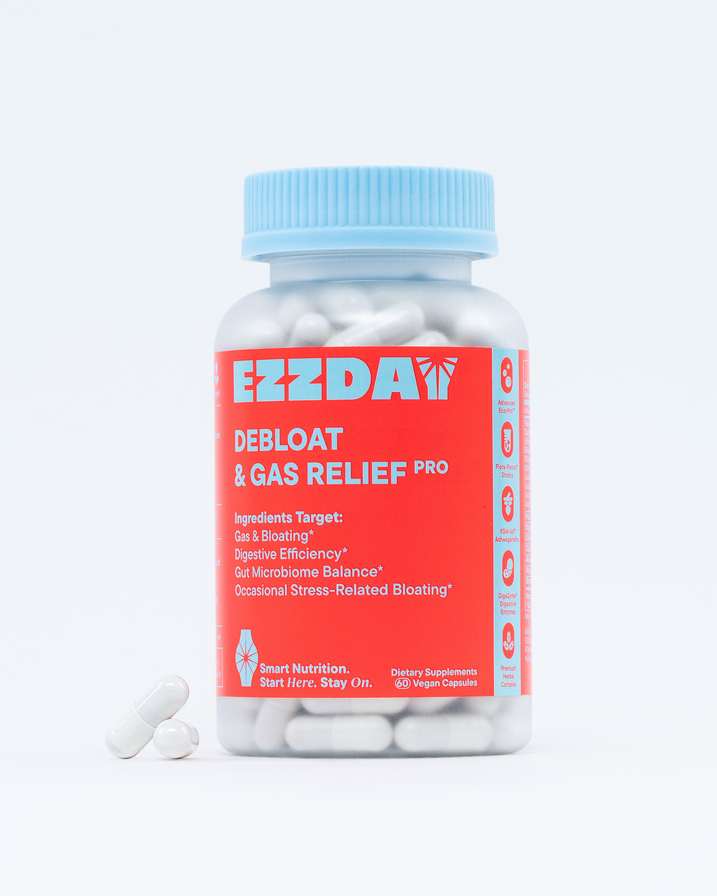 Probiotic supplement bottle with blue cap and red label, shown with capsules