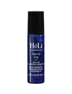 Small blue-labeled cosmetic spray bottle with black cap