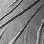 Gray liquid velvet fabric panels with silky sheen, showing smooth drape folds.
