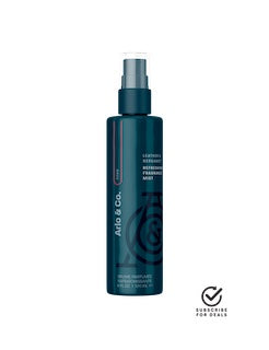 Teal fragrance mist spray bottle with pump top and label