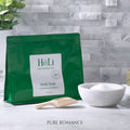 HeLi Body Soak green pouch with label, powder in bowl and wooden scoop