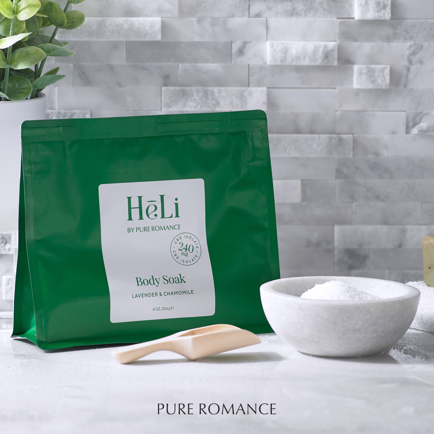 HeLi Body Soak green pouch with label, powder in bowl and wooden scoop