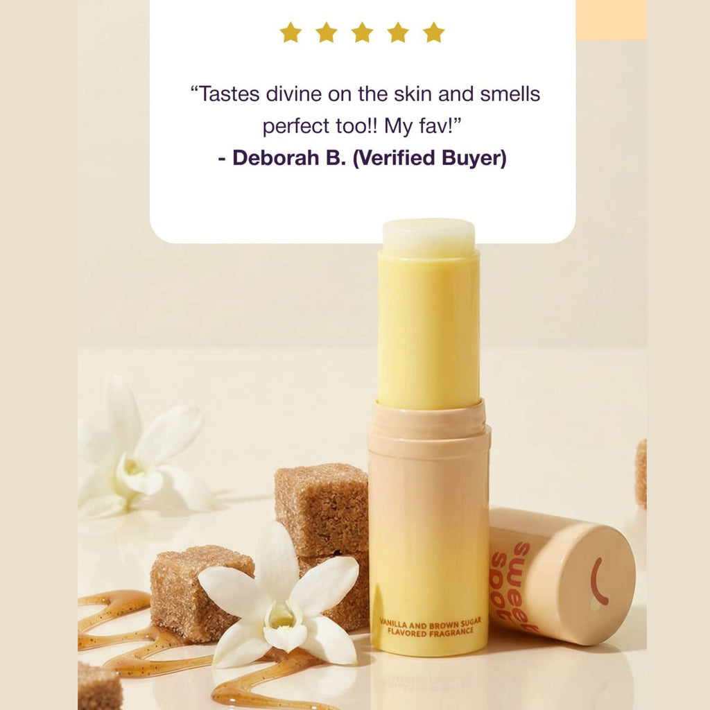 Beige solid fragrance stick with cap open and sugar wax pieces
