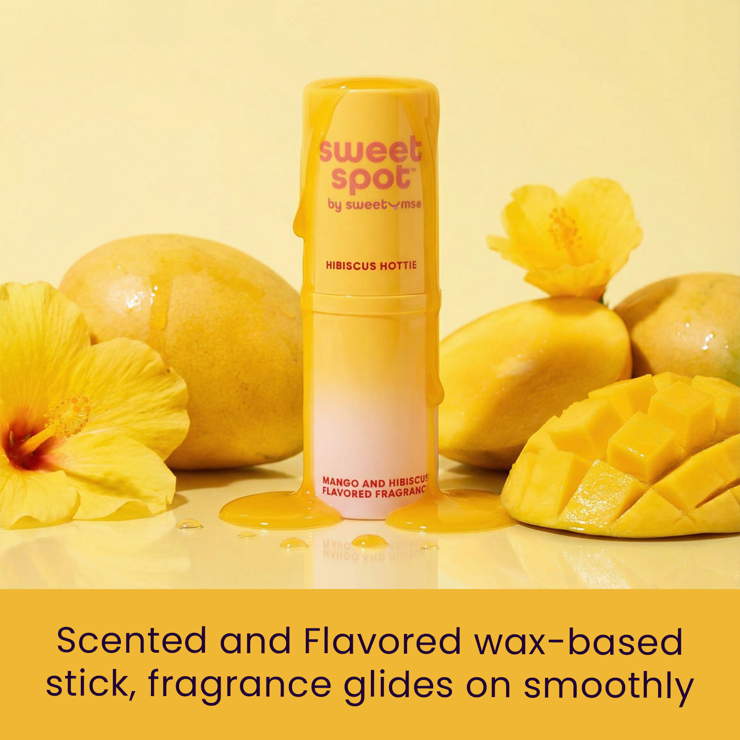 Scented wax-based stick in yellow container with wax cubes and hibiscus decor.