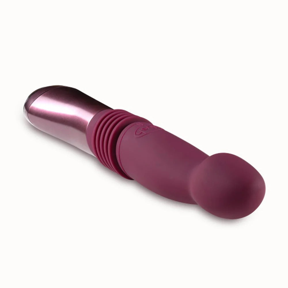 Pink and metallic-silver thrusting vibe with ribbed grip and rounded tip.