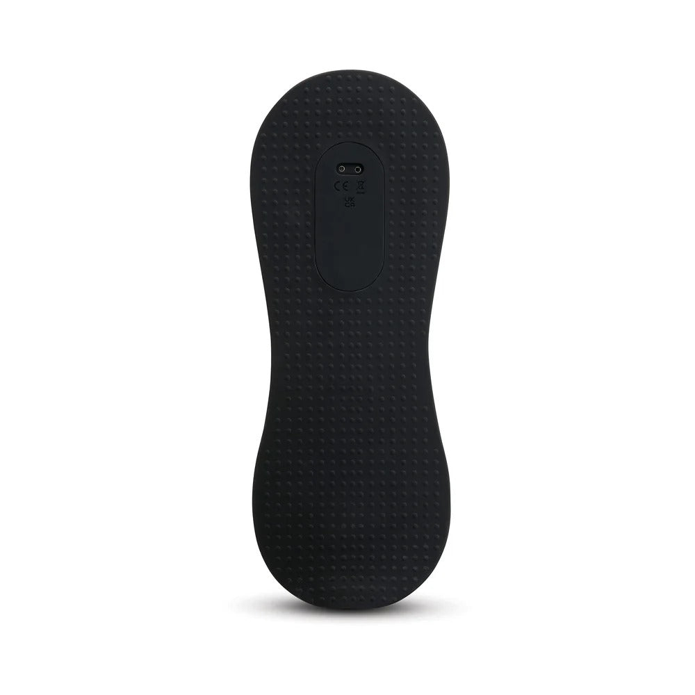 Black silicone foot massager bottom with textured grip surface