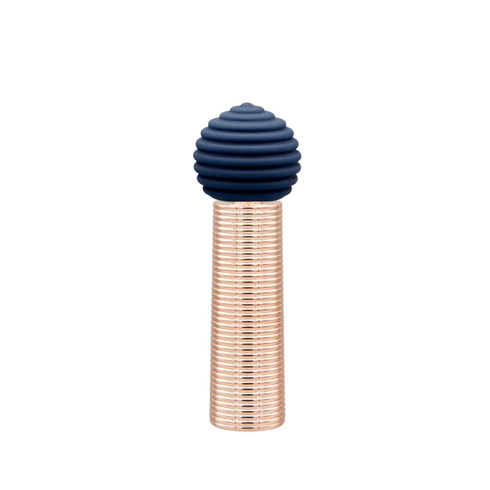 Mini massager with ribbed navy silicone head and clear ridged cylinder