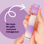 Hands holding a lavender solid fragrance stick with a white outer cap piece
