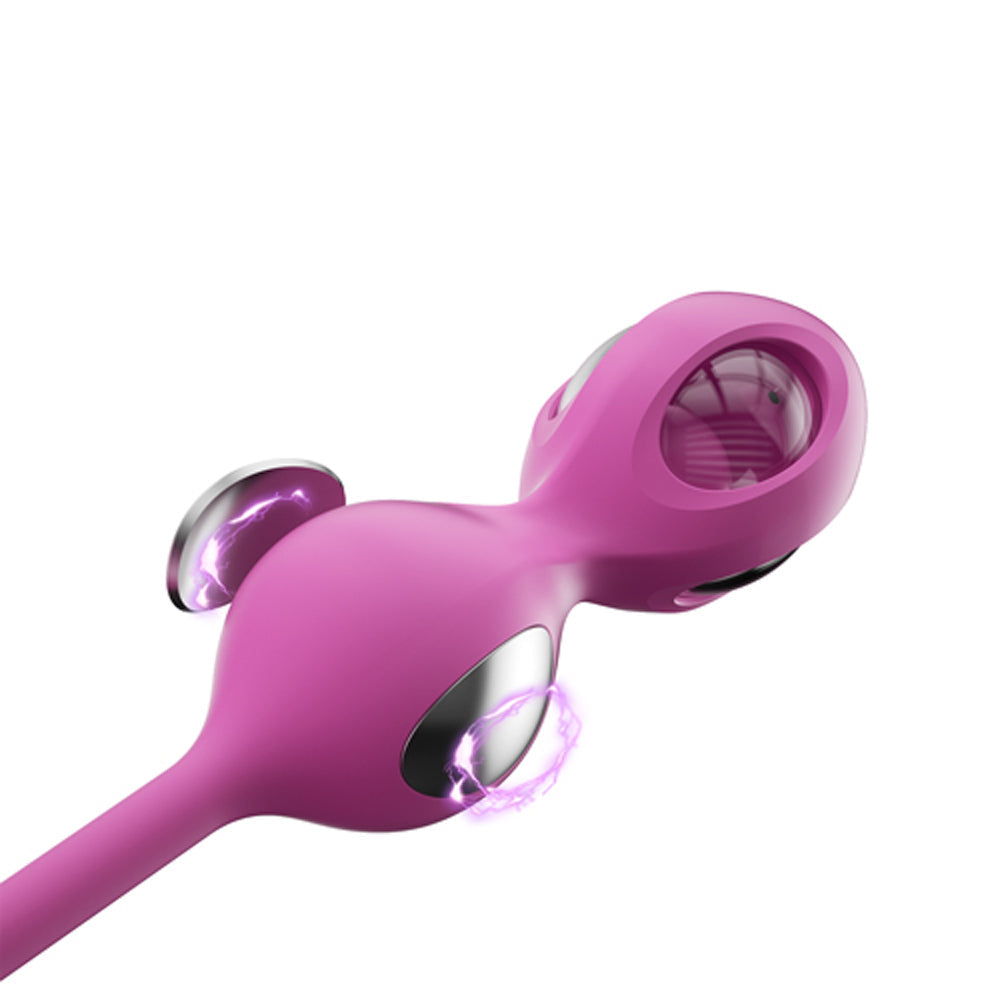 Pink kegel trainer with metallic inner rings and oval insert, side view