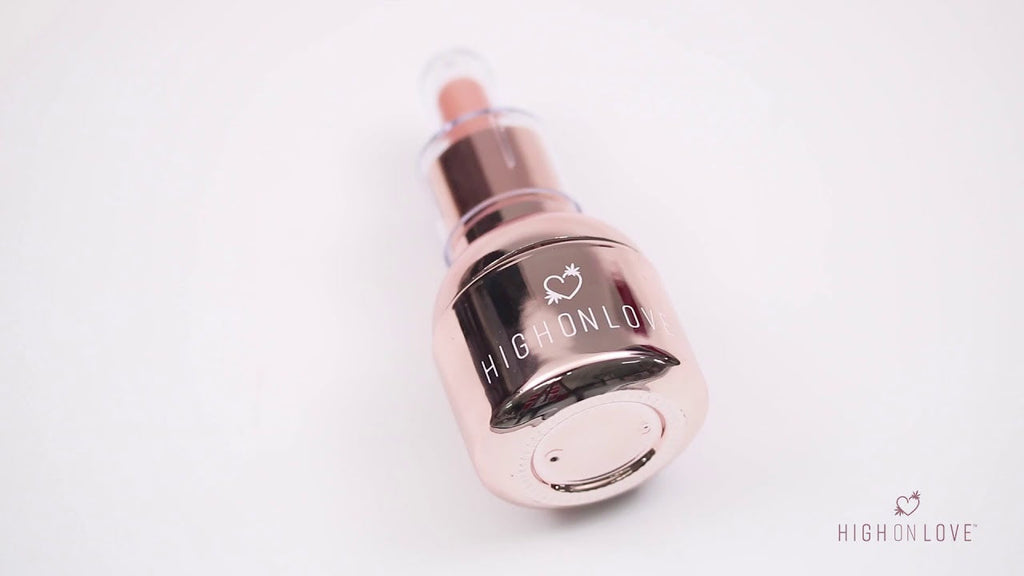 Rose gold oil bottle with heart logo and dropper