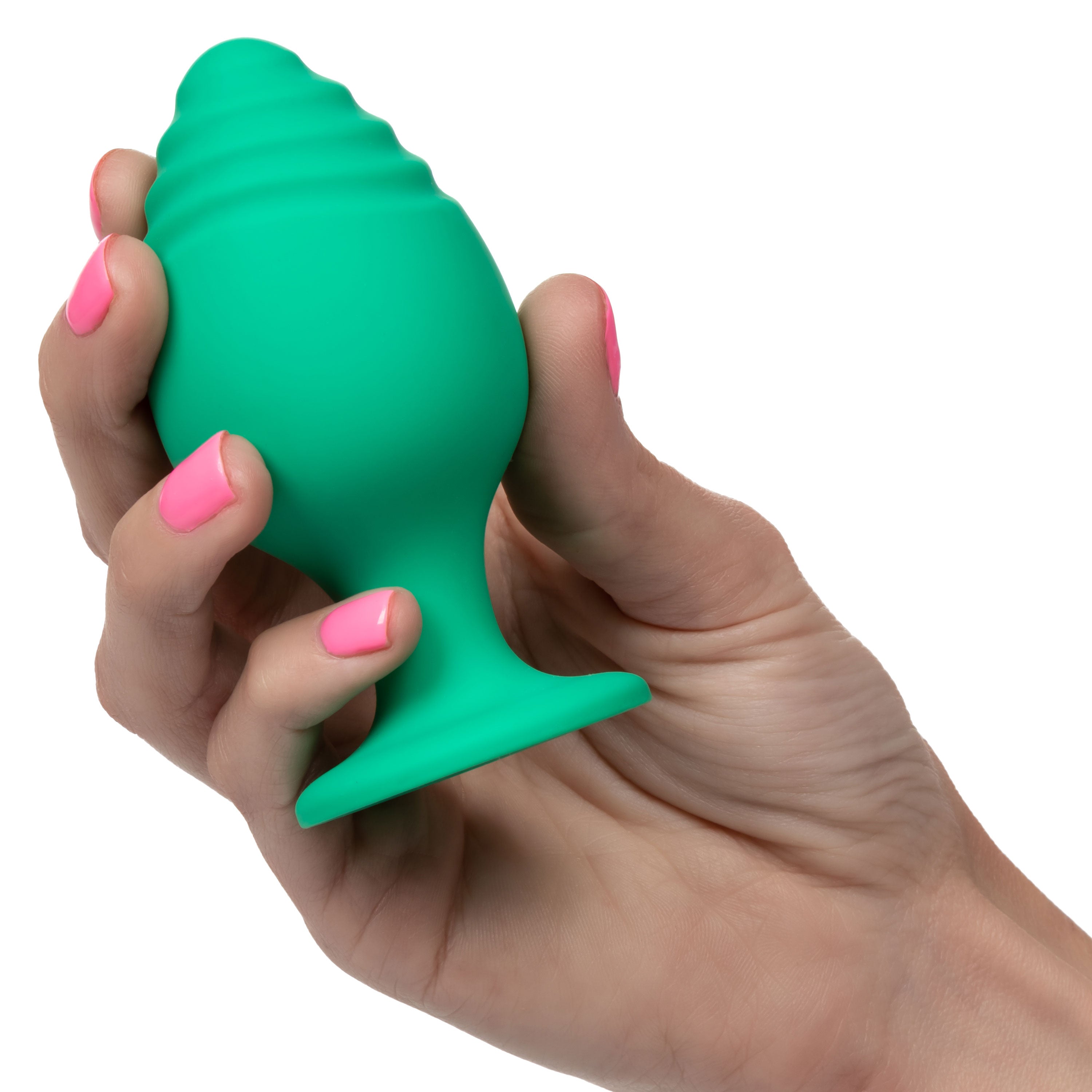 Green silicone anal plug held in hand, flared ribbed base
